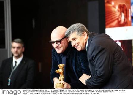 Feb. 20, 2016 - Berlin, Germany - Director of the winner film Fuocoammare, Fire at Sea, Gianfranco Rosi and actor Pietro Bartolo present Golden Bear Award for the best film at the 66th Berlinale. Berlin Germany - ZUMAp133