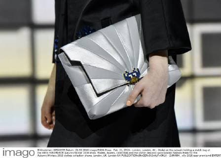 Feb. 21, 2016 - London, London, UK - Model on the catwalk holding a clutch bag at the ANYA HINDMARCH Autumn Winter 2016 show. Models, buyers, celebrities and the stylish descend upon London Fashion Week for the Autumn Winters 2016 clothes collection shows. London, UK. London UK  - ZUMAl94_