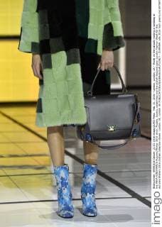 Feb. 21, 2016 - London, London, UK - Model on the catwalk holding a handbag at the ANYA HINDMARCH Autumn Winter 2016 show. Models, buyers, celebrities and the stylish descend upon London Fashion Week for the Autumn Winters 2016 clothes collection shows. London, UK. London UK  - ZUMAl94_