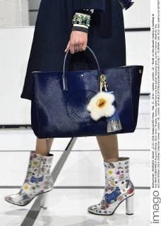 Feb. 21, 2016 - London, London, UK - Model on the catwalk holding a handbag at the ANYA HINDMARCH Autumn Winter 2016 show. Models, buyers, celebrities and the stylish descend upon London Fashion Week for the Autumn Winters 2016 clothes collection shows. London, UK. London UK  - ZUMAl94_