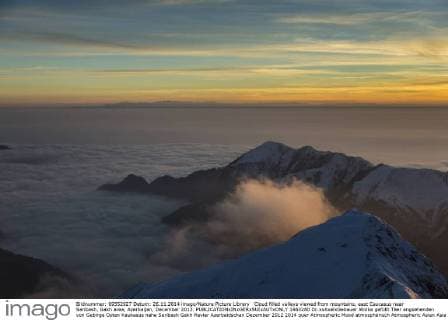 Cloud filled valleys viewed from mountains, east Caucasus near Saribash, Gakh area, Azerbaijan, December 2012.  1463280 Dr.xxAxelxGebauer