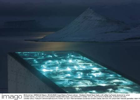 Svalbard Global Seed Vault, with glittering facade designed by artist Dyveke Sanne., on the roof of the Svalbard Global Seed Vault. Light reflected in steel, mirrors, and prisms in landscape, Svalbard, Norway, October 2012.  1473577 PalxHermansen