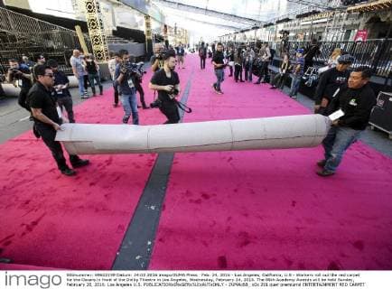 Feb. 24, 2016 - Los Angeles, California, U.S - Workers roll out the red carpet for the Oscars in front of the Dolby Theatre in Los Angeles, Wednesday, February 24, 2016. The 88th Academy Awards will be held Sunday, February 28, 2016. Los Angeles U.S. - ZUMAc68_