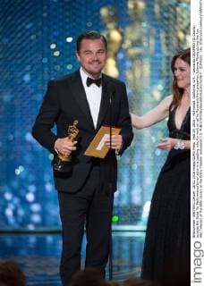 Feb 28, 2016 - Hollywood, California, U.S. - Leonardo DICAPRIO (Di Caprio) accepts the Oscar for Performance by an actor in a Leading role, for work on œThe Revenant from presenter Julianne Moore during the live ABC Telecast of The 88th Oscars at the Dolby Theatre. Hollywood U.S. - ZUMAz03_