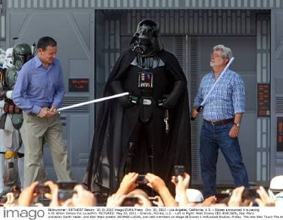 Oct. 30, 2012 - Los Angeles, California, U.S. - Disney announced it is paying 4.05 Billion Dollars For Lucasfilm. PICTURED: May 20, 2011 - Orlando, Florida, U.S. - Left to Right: Walt Disney CEO BOB IGER, Star Wars character Darth Vader, and Star Wars creator GEORGE LUCAS, join cast members on stage at Disney s Hollywood Studios, Friday. The new Star Tours-The Adventures Continue, ride opened Friday. - ZUMAs70_