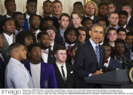 Members of the 2015-2016 College Football Playoff National Champion Alabama Crimson Tide watch while U.S. President Barack Obama offers remarks as he honors their championship in the East Room at The White House in Washington, D.C., on March 2, 2016. Pool photo by Rod Lamkey  WAX20160302201 RODxLAMKEYxJR.