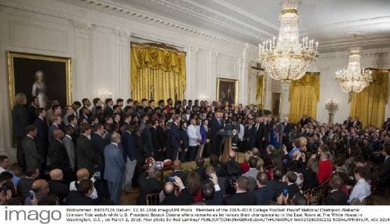 Members of the 2015-2016 College Football Playoff National Champion Alabama Crimson Tide watch while U.S. President Barack Obama offers remarks as he honors their championship in the East Room at The White House in Washington, D.C., on March 2, 2016. Pool photo by Rod Lamkey  WAX20160302202 RODxLAMKEYxJR.