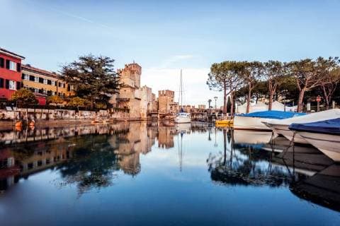 Italy, Lombary, Sirmione, Sailing ships at harbour  DAWF000471