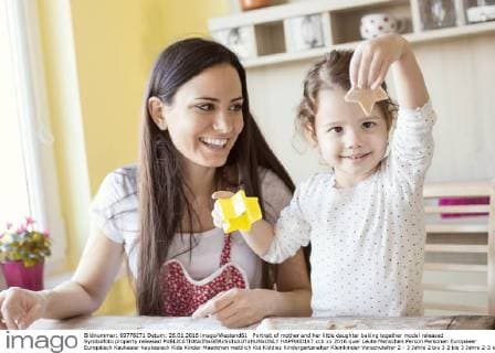 Portrait of mother and her little daughter baking together model released Symbolfoto property released  HAPF000147