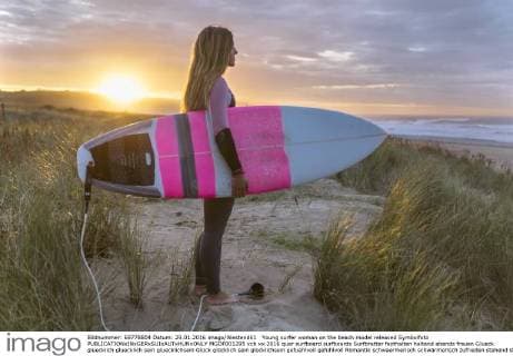Young surfer woman on the beach model released Symbolfoto  MGOF001295