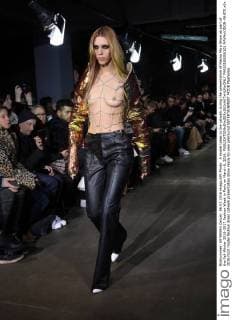 A model takes to the catwalk during the presentation of Masha Ma s Show as part of the Fall-Winter 2016-2017 Fashion Week in Paris on March 6, 2016.  PAR20160306101 MAYAxVIDON-WHITE