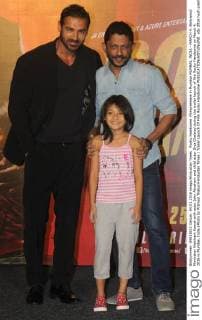 Rocky Handsome Filmpremiere in Mumbai MUMBAI, INDIA - MARCH 4: Bollywood filmmaker Nishikant Kamat with actor John Abraham and child actor Diya Chalwad during the trailer launch of film Rocky Handsome on March 4, 2016 in Mumbai, India.(Photo by Pramod Thakur Hindustan Times ) Trailer Launch Of Film Rocky Handsome