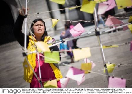 MEXICO CITY, March 8, 2016 -- A woman places a message in an installation called The Clothesline during an event organized my the movement Amnesty International to mark the International Women s Day at the esplanade of Fine Arts Palace, in Mexico City, capital of Mexico, on March 8, 2016. ) (jp) (fnc) MEXICO-MEXICO CITY-SOCIETY-WOMEN S DAY PedroxMera 