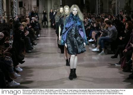 A model takes to the catwalk during the presentation of Moon Young Hee s show as part of the Fall-Winter 2016-2017 Fashion Week in Paris on March 9, 2016.  PAR20160309102 MAYAxVIDON-WHITE