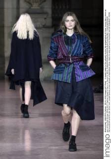 A model takes to the catwalk during the presentation of Moon Young Hee s show as part of the Fall-Winter 2016-2017 Fashion Week in Paris on March 9, 2016.  PAR20160309105 MAYAxVIDON-WHITE