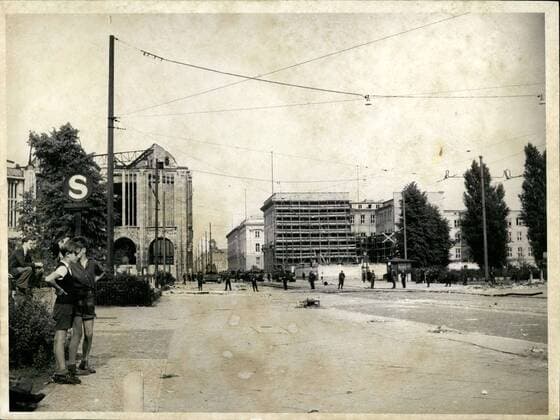 1953 - Demonstrations and riots in East - Berlin - Soviet Occupation Troops go into action against Civilian population: Heavy demonstrations and street -fights occurred in Berlin when laborers residing in East Berlin revolted against the East German Blood - Regime. Trusting that the Soviet high Commissioner, Semjono~, would immediately remove the Ulbricht - Grotsewohl government, the laborers rose-up and demanded liberty, freedom of speech and De-activation of the People s Police . To the surprise of many demonstrators, the Russian town commander ordered a tank - brigade into the threatened area, in order to maintain public security and to protect the life of Soviet citizens. Soviet tanks in the Streets of Berlin. Discouraged liberty - Seeking youngsters are seen waiting at a Berlin crossroad, while Soviet tanks (See background) are waiting for immediate action - ZUMAk09_
