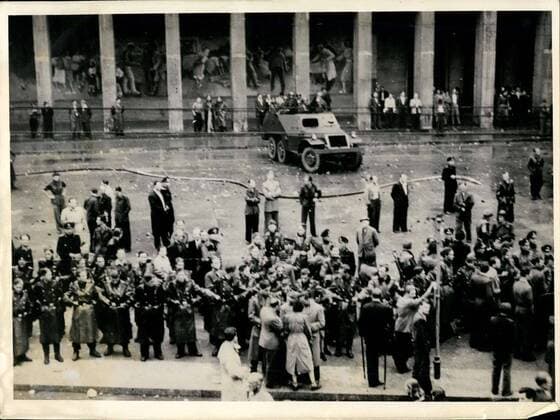 1953 - Demonstrations and riots in East - Berlin - Soviet Occupation Troops go into action against Civilian population: Heavy demonstrations and street -fights occurred in Berlin when laborers residing in East Berlin revolted against the East German Blood - Regime. Trusting that the Soviet high Commissioner, Semjono~, would immediately remove the Ulbricht - Grotsewohl government, the laborers rose-up and demanded liberty, freedom of speech and De-activation of the People s Police . To the surprise of many demonstrators, the Russian town commander ordered a tank - brigade into the threatened area, in order to maintain public security and to protect the life (Illegible) . Radio-photo released from our Berlin-office today shows. (Foreground ), A chain of People s Police seen blocking the way to a red palace, in East Berlin, while People -police s scout cars are waiting in backgrou - ZUMAk09_