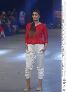 Pakistan Fashion Design Council Fashion Week in Lahore Pakistani model presents creations of the famous designer SAIQA RAHEEM on the first day of Pakistan Fashion Design Council (PFDC) Fashion Week.  RanaxSajidxHussain