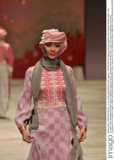 Shafira Muslim Fashion Clothing presents at Indonesia Fashion Week 2016 A model wears designed by Shafira Muslim fashion brand during the Indonesia Fashion Week 2016 in New York town atmosphere in the epic broadway full of nuances of lights.  Azwar