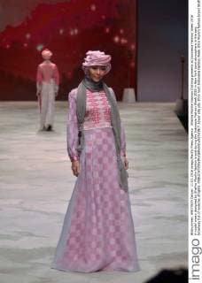 Shafira Muslim Fashion Clothing presents at Indonesia Fashion Week 2016 A model wears designed by Shafira Muslim fashion brand during the Indonesia Fashion Week 2016 in New York town atmosphere in the epic broadway full of nuances of lights.  Azwar