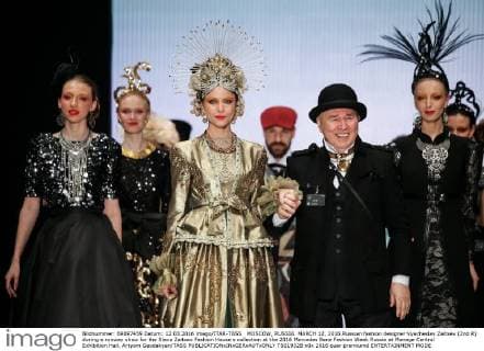 MOSCOW, RUSSIA. MARCH 12, 2016.Russian fashion designer Vyacheslav Zaitsev (2nd R) during a runway show for the Slava Zaitsev Fashion House s collection at the 2016 Mercedes Benz Fashion Week Russia at Manege Central Exhibition Hall. Artyom Geodakyan TASS  TS01932B