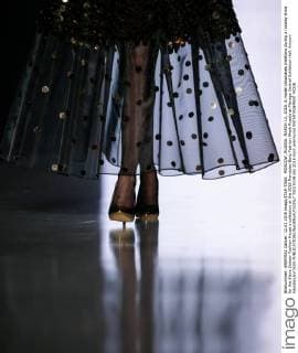 MOSCOW, RUSSIA. MARCH 12, 2016. A model showcases creations during a runway show for the Slava Zaitsev Fashion House s collection at the 2016 Mercedes Benz Fashion Week Russia at Manege Central Exhibition Hall. Artyom Geodakyan TASS  TS019339