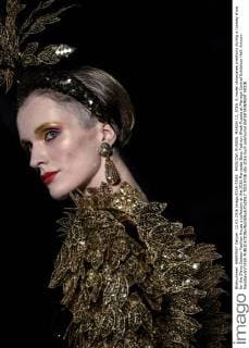 MOSCOW, RUSSIA. MARCH 12, 2016. A model showcases creations during a runway show for the Slava Zaitsev Fashion House s collection at the 2016 Mercedes Benz Fashion Week Russia at Manege Central Exhibition Hall. Artyom Geodakyan TASS  TS01933E