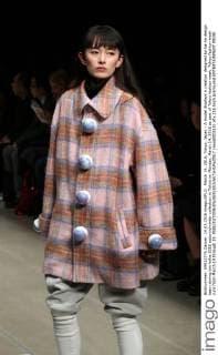 March 14, 2016, Tokyo, Japan - A model displays a creation designed by ha-ha design team during the haha 2016 autumn winter collection in Tokyo on Monday, March 14, 2016 as part of Tokyo fashion week. Tokyo fashion week runs from March 14 through 19.  (lwxa000310)