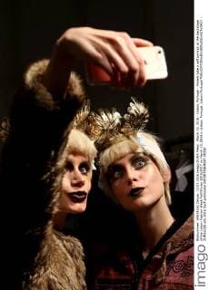 March 13, 2016 - Lisbon, Portugal - Models take a self portrait at the backstage of the Lisbon Fashion Week Fall Winter 2016 2017 on March 13, 2016 in Lisbon, Portugal. Lisbon Portugal  - ZUMAn230