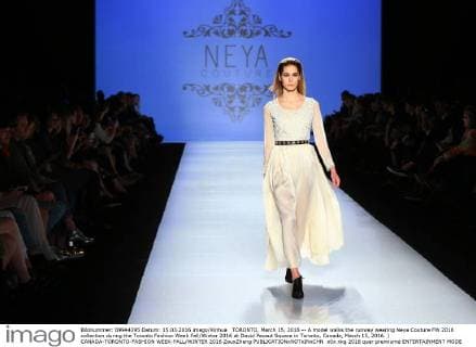 TORONTO, March 15, 2016 -- A model walks the runway wearing Neya Couture FW 2016 collection during the Toronto Fashion Week Fall Winter 2016 at David Pecaut Square in Toronto, Canada, March 15, 2016. ) CANADA-TORONTO-FASHION WEEK-FALL WINTER 2016 ZouxZheng 