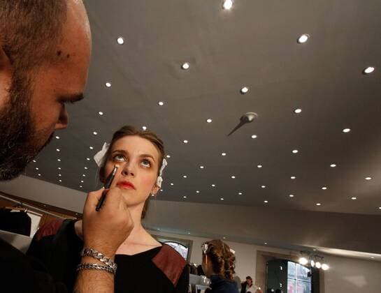 Portugal: Fashion Week A model is made up before her Fall Winter 2016 collection fashion show during Portugal Fashion Week in Porto.  NunoxGuimaraes