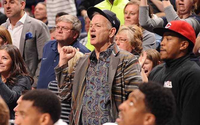 Actor Bill Murray cheers on Xavier from behind their bench as they play Wisconsin in the NCAA Division 1 Men s Basketball Championship at the Scottrade Center in St. Louis on March 20, 2016. Murray s son Luke is an assistant coach with the team. Wisconsin defeated Xavier, 66-63.  SLP2016032013