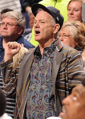 Actor Bill Murray cheers on Xavier from behind their bench as they play Wisconsin in the NCAA Division 1 Men s Basketball Championship at the Scottrade Center in St. Louis on March 20, 2016. Murray s son Luke is an assistant coach with the team. Wisconsin defeated Xavier, 66-63.  SLP2016032015