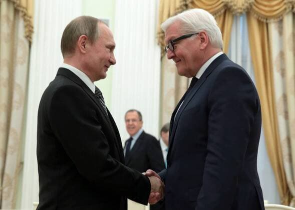 MOSCOW, RUSSIA. MARCH 23, 2016. Russia s President Vladimri Putin and Germany s Foreign Minister Frank Walter Steinmeier (L-R front) shake hands as they meet at the Moscow Kremlin. Pictured background is Russia s Foreign Minister Sergei Lavrov. Mikhail Metzel TASS  TS01D28B
