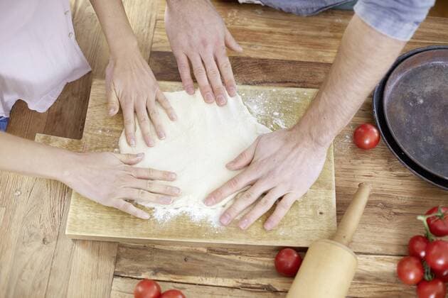 Couple preparing yeast dough model released Symbolfoto property released  FMKF002384