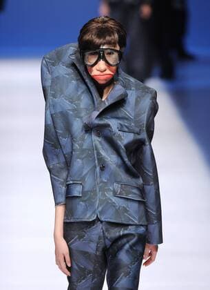 BEIJING, CHINA - MARCH 29: (CHINA OUT) A model showcases designs on the runway at Beijing Institute of Fashion Technology¡¤Emerging Design Collection & BIFT¡¤ELLASSAY Scholarship Awarding Ceremony during the Mercedes-Benz China Fashion Week Autumn Winter 2016 2017 at Beijing Hotel on March 29, 2016 in Beijing, China.  CFP481872778