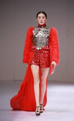 BEIJING, CHINA - MARCH 29: (CHINA OUT) A model showcases designs on the runway at Beijing Institute of Fashion Technology¡¤Emerging Design Collection & BIFT¡¤ELLASSAY Scholarship Awarding Ceremony during the Mercedes-Benz China Fashion Week Autumn Winter 2016 2017 at Beijing Hotel on March 29, 2016 in Beijing, China.  CFP481872870