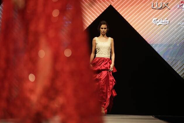 March 30, 2016 - Kathmandu, Nepal - A model catwalk on the runway during the Nepal fashion week also known as The Himalayan Times TGIF Nepal Fashion Week at Hyatt Regency in Kathmandu, Nepal on Wednesday, March 30, 2016. Celebrities and fashion models from around the world come to represent for the designers to promote their designs. The event is the top most fashion week of the country held annually by The Himalayan Times, a leading and largest selling English daily newspaper in Nepal. The fashion week lasts for 4 days with glitz and glamor on the catwalk. Kathmandu Nepal - ZUMAg200