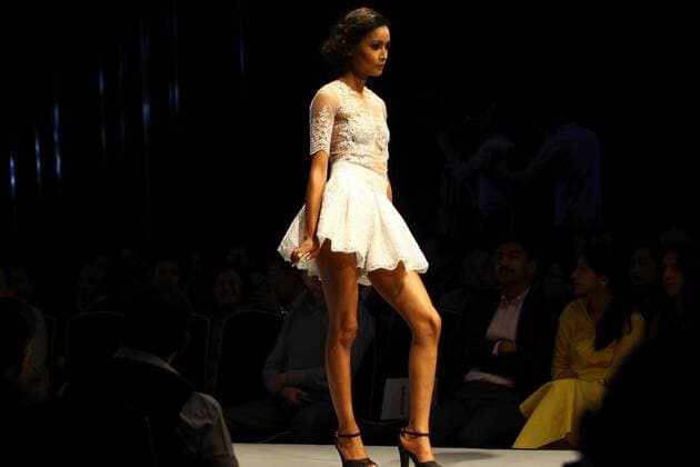 A model wearing designers clothes walks on the stage during the first day of TGIF Nepal Fashion week in Kathmandu, Nepal, March 30, 2016. The four-day fashion week will present both domestic and foreign designers creations. ) NEPAL-KATHMANDU-TGIF NEPAL FASHION WEEK SunilxSharma 