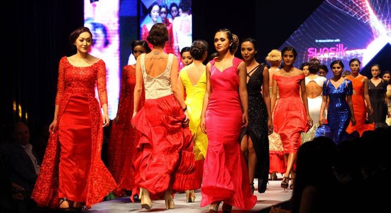 Models wearing designers clothes walk on the stage during the first day of TGIF Nepal Fashion week in Kathmandu, Nepal, March 30, 2016. The four-day fashion week will present both domestic and foreign designers creations. ) NEPAL-KATHMANDU-TGIF NEPAL FASHION WEEK SunilxSharma 