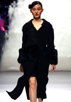 Models showcase fashion designs by Zoual Yanti during China s fashion week in Beijing on March 31, 2016. Chinese fashion designers are becoming an international force with both European and American fashion houses looking at the new, fresh Chinese clothing-minds as potential partners in future clothing brands.  PEK2016033123 STEPHENxSHAVER