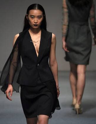 Models showcase fashion designs by Zoual Yanti during China s fashion week in Beijing on March 31, 2016. Chinese fashion designers are becoming an international force with both European and American fashion houses looking at the new, fresh Chinese clothing-minds as potential partners in future clothing brands.  PEK2016033144 STEPHENxSHAVER