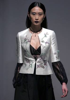 Models showcase fashion designs by Zoual Yanti during China s fashion week in Beijing on March 31, 2016. Chinese fashion designers are becoming an international force with both European and American fashion houses looking at the new, fresh Chinese clothing-minds as potential partners in future clothing brands.  PEK2016033146 STEPHENxSHAVER