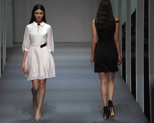 Models showcase fashion designs by Zoual Yanti during China s fashion week in Beijing on March 31, 2016. Chinese fashion designers are becoming an international force with both European and American fashion houses looking at the new, fresh Chinese clothing-minds as potential partners in future clothing brands.  PEK2016033149 STEPHENxSHAVER