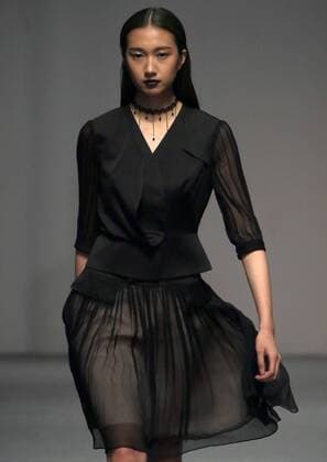 Models showcase fashion designs by Zoual Yanti during China s fashion week in Beijing on March 31, 2016. Chinese fashion designers are becoming an international force with both European and American fashion houses looking at the new, fresh Chinese clothing-minds as potential partners in future clothing brands.  PEK2016033150 STEPHENxSHAVER