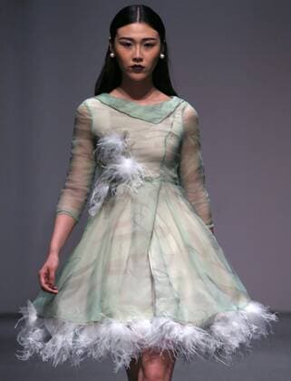 Models showcase fashion designs by Zoual Yanti during China s fashion week in Beijing on March 31, 2016. Chinese fashion designers are becoming an international force with both European and American fashion houses looking at the new, fresh Chinese clothing-minds as potential partners in future clothing brands.  PEK2016033152 STEPHENxSHAVER