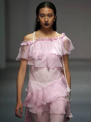 Models showcase fashion designs by Zoual Yanti during China s fashion week in Beijing on March 31, 2016. Chinese fashion designers are becoming an international force with both European and American fashion houses looking at the new, fresh Chinese clothing-minds as potential partners in future clothing brands.  PEK2016033153 STEPHENxSHAVER