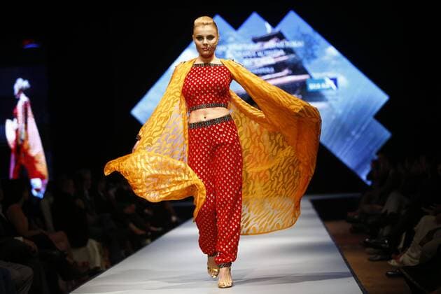 March 31, 2016 - Kathmandu, Nepal - A model catwalk on the runway on the second day of Nepal fashion week also known as The Himalayan Times TGIF Nepal Fashion Week at Hyatt Regency in Kathmandu, Nepal on Thursday, March 31, 2016. Celebrities and fashion models from around the world come to represent for the designers to promote their designs. The event is the top most fashion week of the country held annually by The Himalayan Times, a leading and largest selling English daily newspaper in Nepal. The fashion week lasts for 4 days with glitz and glamor on the catwalk. Kathmandu Nepal - ZUMAg200