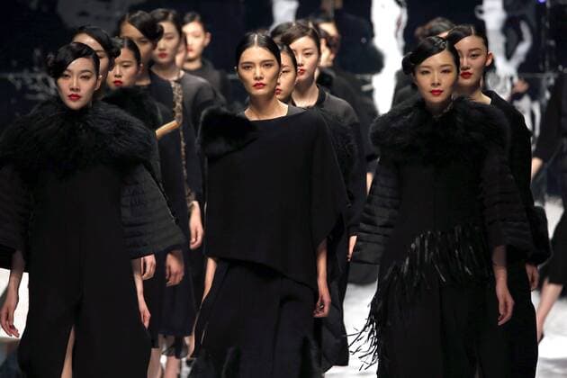 Models showcase fashion designs by Zoual Yanti during China s fashion week in Beijing on March 31, 2016. Chinese fashion designers are becoming an international force with both European and American fashion houses looking at the new, fresh Chinese clothing-minds as potential partners in future clothing brands.  PEK2016033133 STEPHENxSHAVER