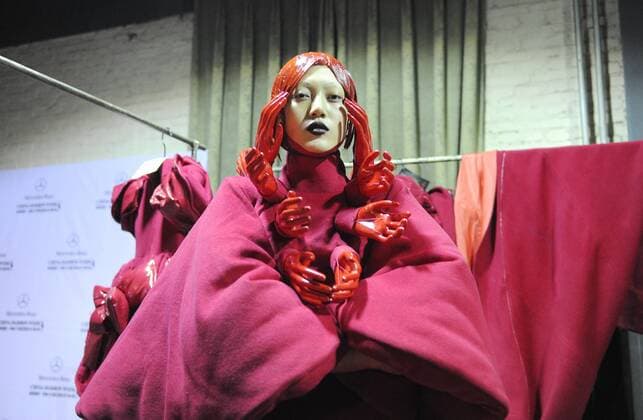 BEIJING, CHINA - MARCH 31: (CHINA OUT) A model prepares at backstage prior to the Sheguang Hu Collection during the Mercedes-Benz China Fashion Week Autumn Winter 2016 2017 at 751D.Park on March 31, 2016 in Beijing, China.  CFP481979939
